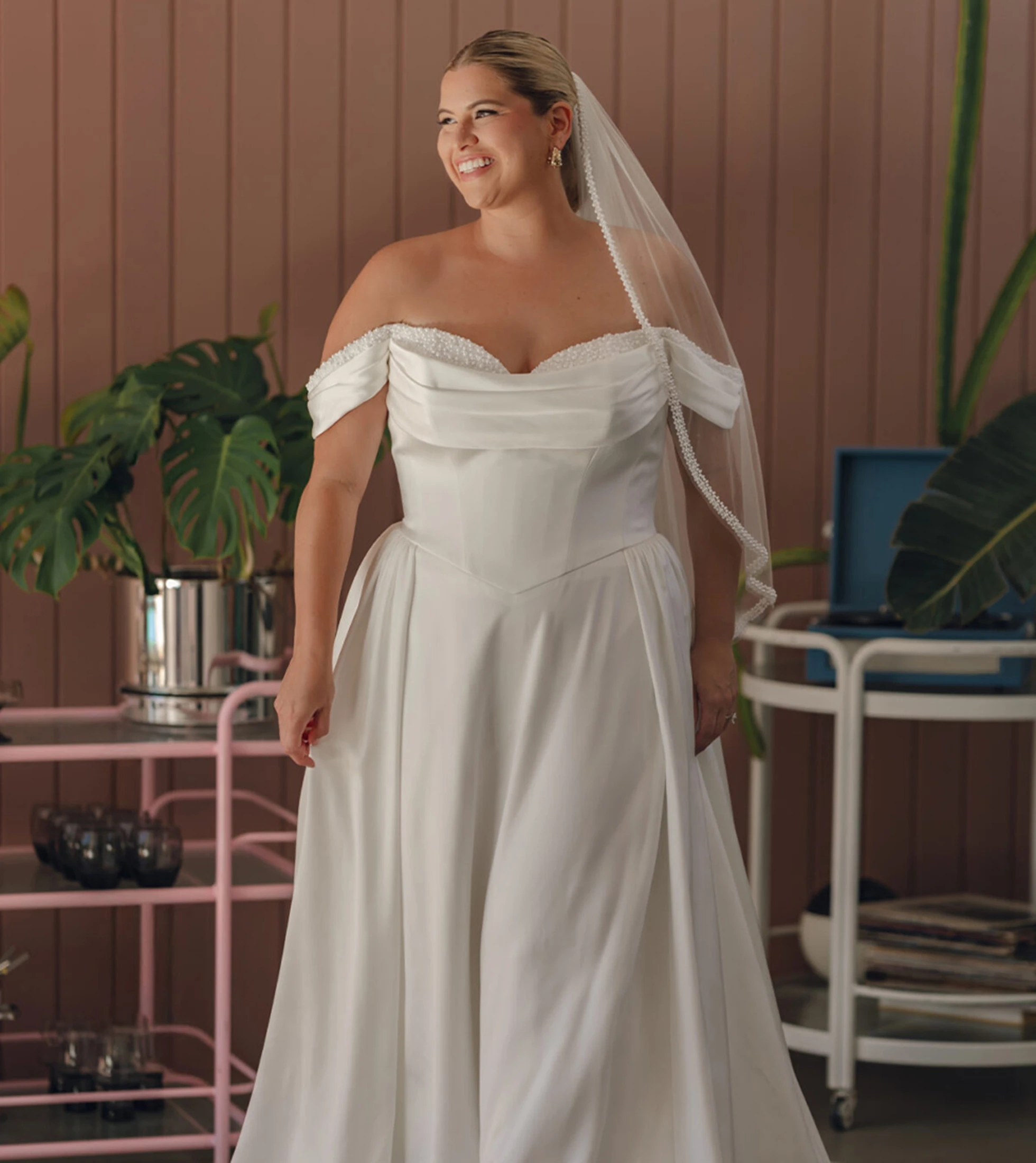 Model wearing a white white gown